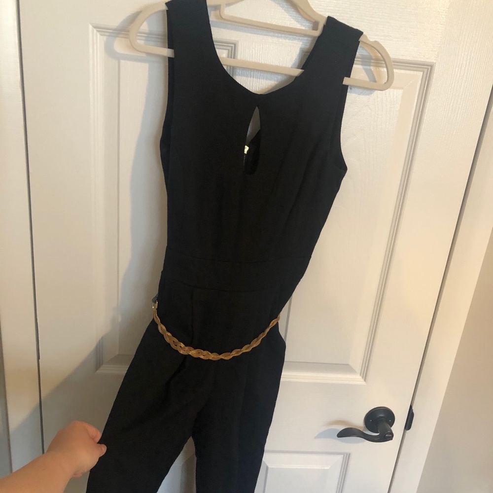 Black jumpsuit with gold belt